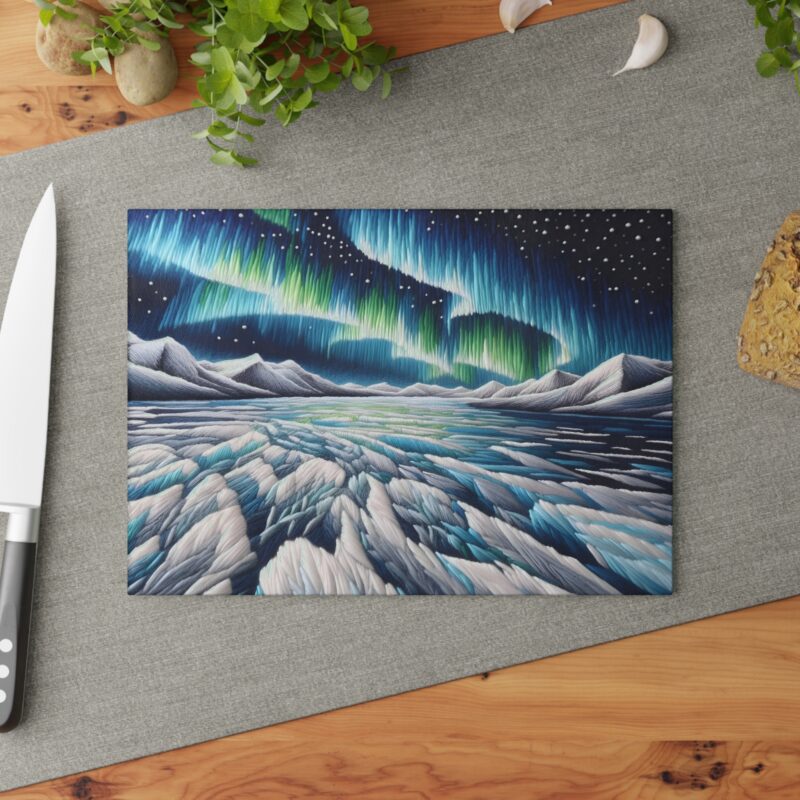 A serene blue and white glass cutting board with a design inspired by the arctic landscape.